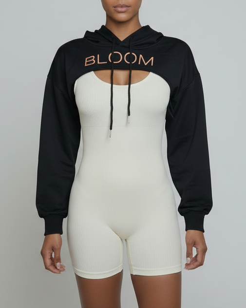 woman wearing a black 'BLOOM' cropped hoodie