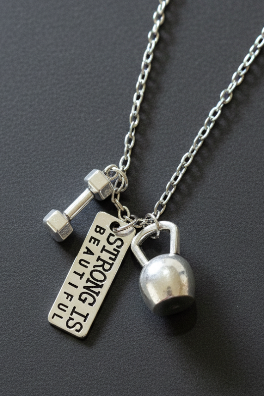 Strong Is Beautiful necklace with kettlebell charm and engraved tag
